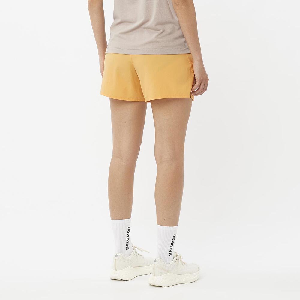 Pantaloni scurți Salomon Shakeout Core 2 În 1 4'' W portocaliu deschis