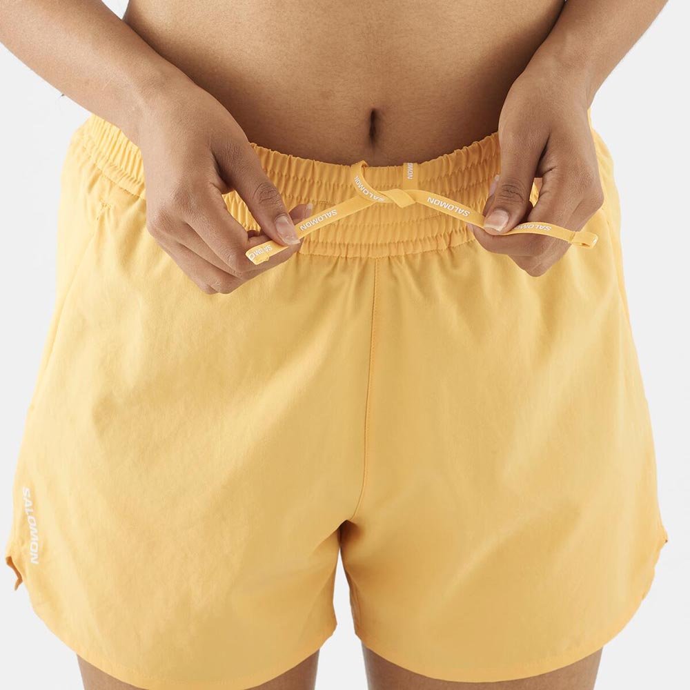 Pantaloni scurți Salomon Shakeout Core 2 În 1 4'' W portocaliu deschis